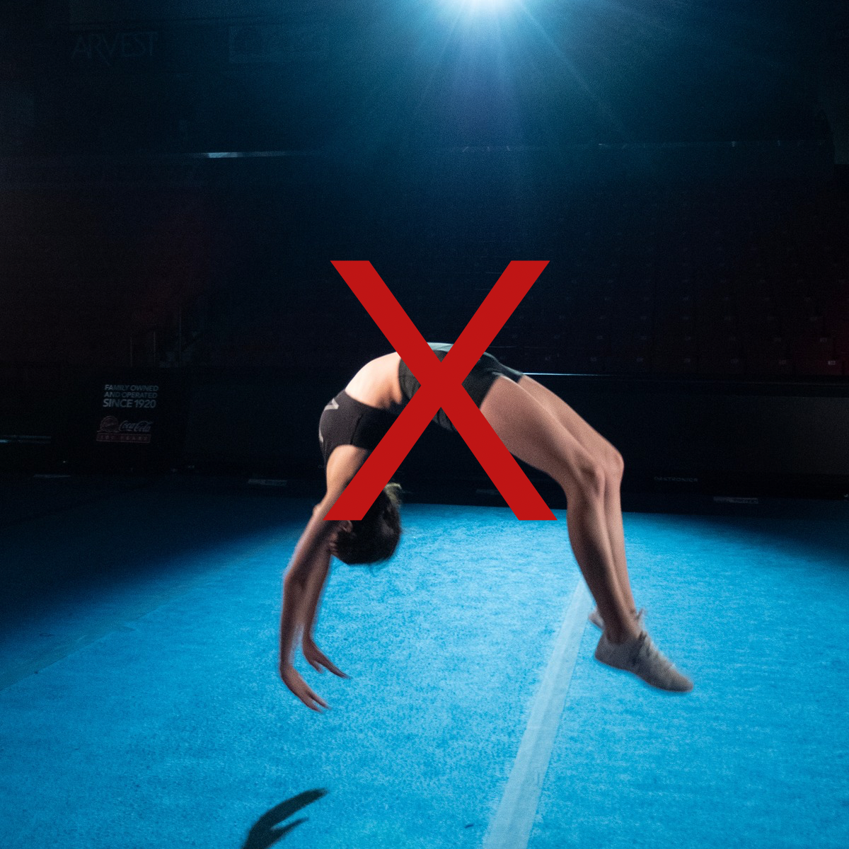 shows improper form of a back handspring